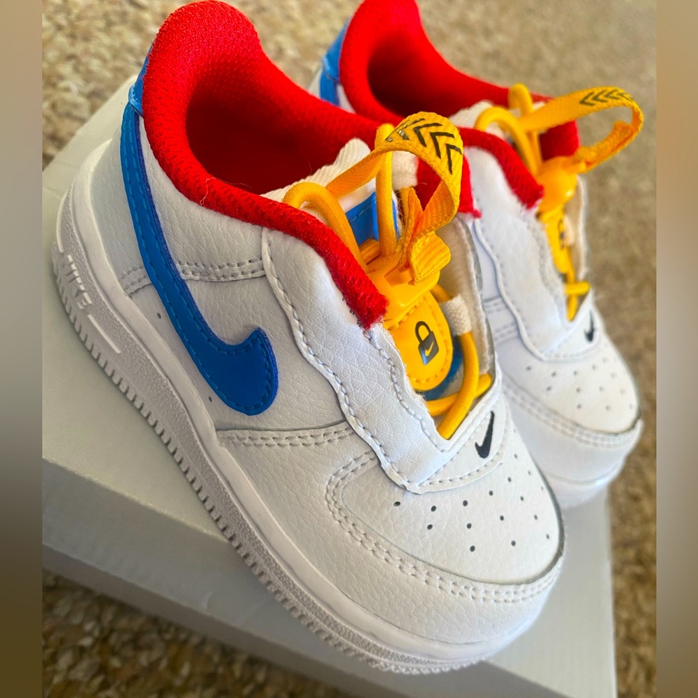 Nike Force 1 Toggle (td) size 5C in color red, white and blue. Moderately worn.